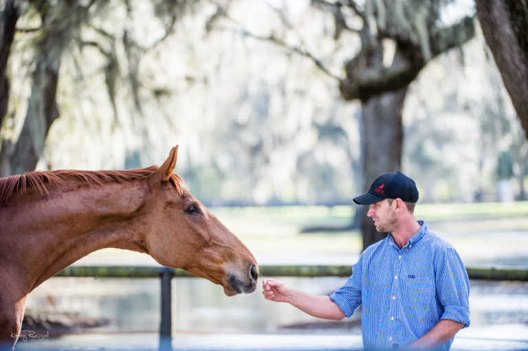 Tik Maynard touching horse